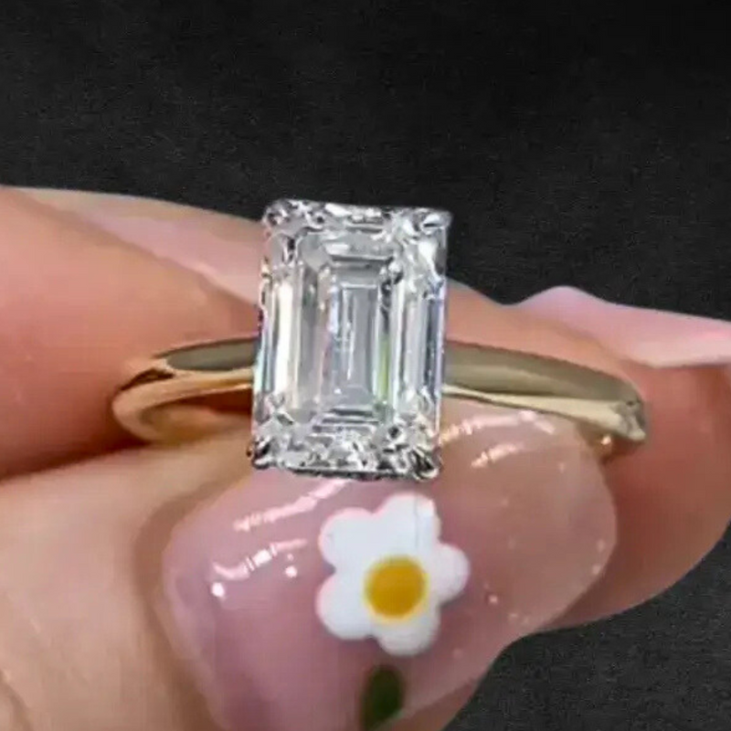 Aureline-Jewelry 2 CT Emerald Cut Lab Diamond Two-Tone Hide Halo Ring