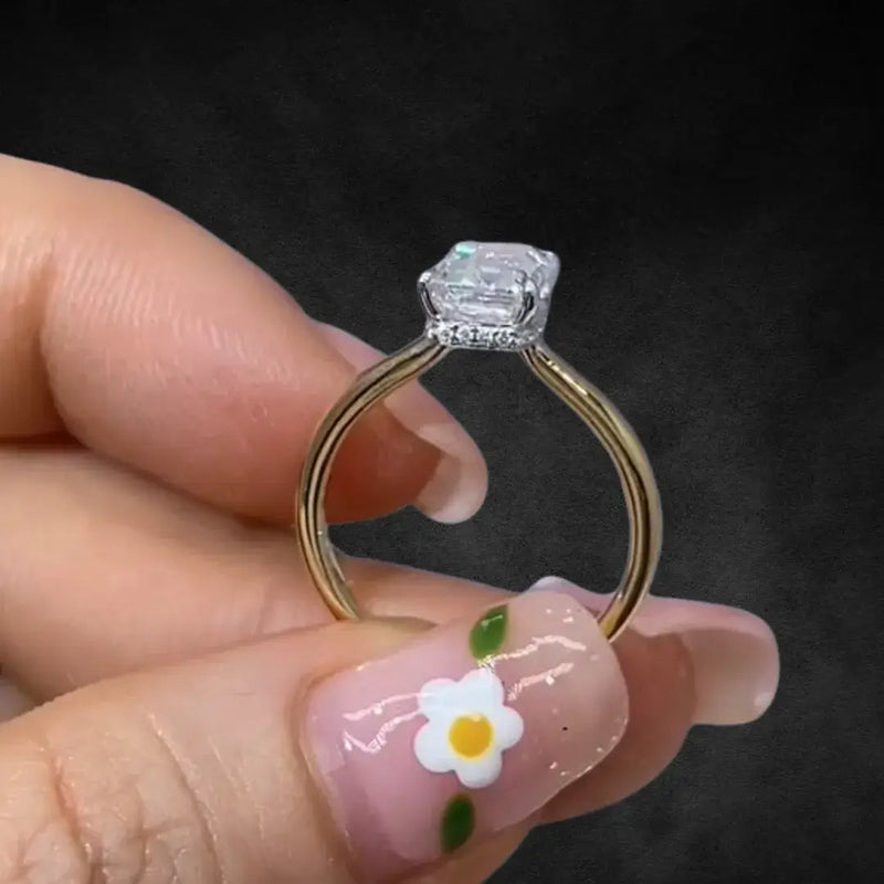 Aureline-Jewelry 2 CT Emerald Cut Lab Diamond Two-Tone Hide Halo Ring