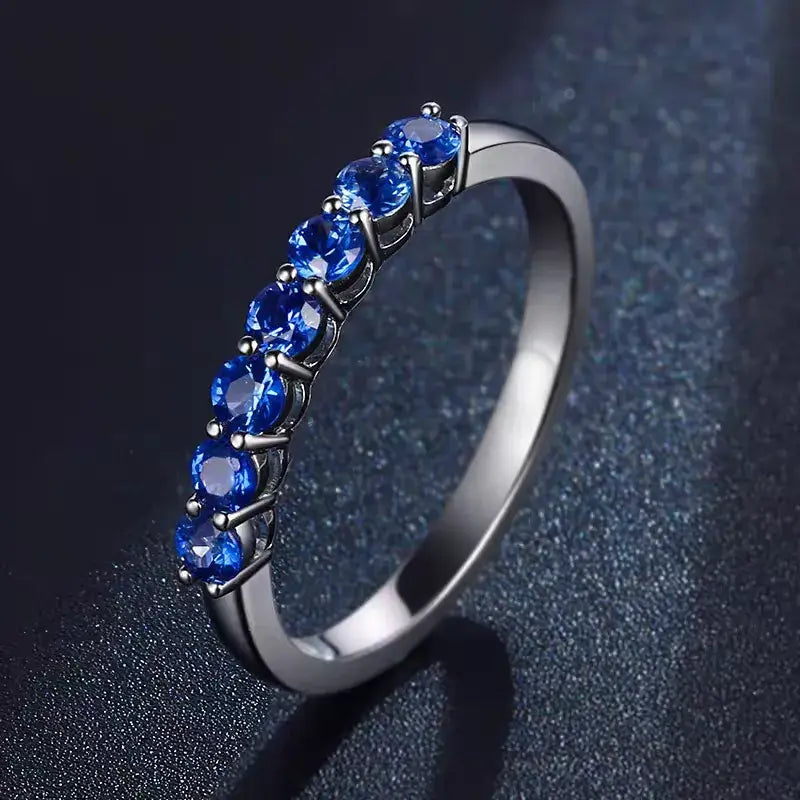 Aureline-Jewelry NOZBO 18K Gold 7-Stone Sapphire Band Ring